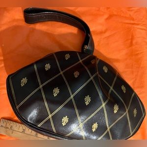 Vintage leather brown and gold clasp purse. Wrist strap with leather side pocket